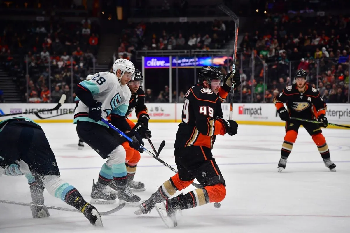 Anaheim Ducks left wing Max Jones (49) loves the puck against Seattle Kraken defenseman Carson Soucy (28) during the second period at Honda Center, in Anaheim, Calif., on Nov. 27, 2022,. (Gary A. Vasquez/USA TODAY Sports via Field Level Media)