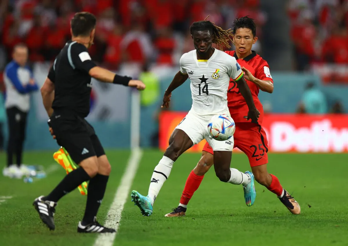 Ghana's Gideon Mensah in action with South Korea's Jeong Woo-yeong during the FIFA World Cup Qatar 2022 Group H match between South Korea and Ghana at Education City Stadium, Al Rayyan, Qatar, on Nov. 28, 2022 (Molly Darlington/Reuters)