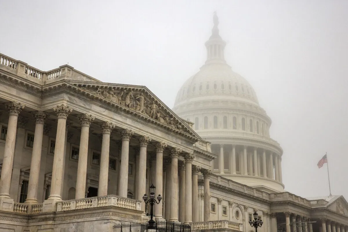 Early morning fog envelopes the U.S. Capitol dome behind the U.S. House of Representatives in Washington on Nov. 4, 2022. (Samuel Corum/Getty Images)
