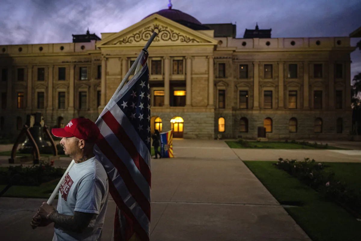A protester outside the Arizona State Capitol Building in Phoenix, Arizona, on Nov. 15, 2022. (Jon Cherry/Getty Images)