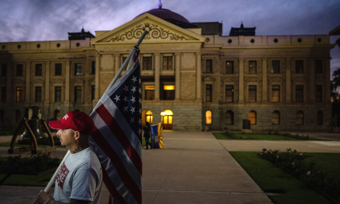 A protester outside the Arizona State Capitol Building in Phoenix, Arizona, on Nov. 15, 2022. (Jon Cherry/Getty Images)