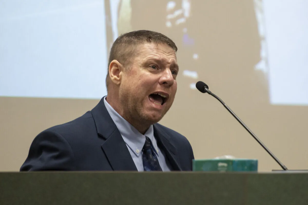 Jacob Blair Scott, who is accused of sexually assaulting a minor, cries out while being cross-examined by Assistant District Attorney Justin Lovorn during his trial in Jackson County Circuit Court in Pascagoula, Miss., on June 1, 2022. (Hannah Ruhoff/The Sun Herald via AP)