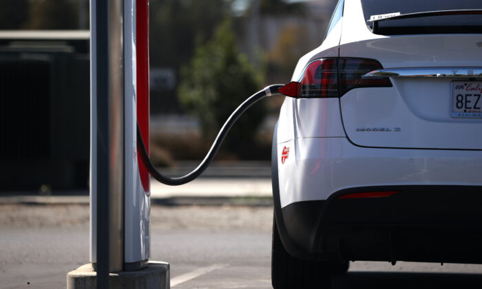 A Tesla car sits parked at a Tesla Supercharger in Petaluma, Calif., on Sept. 23, 2020. (Justin Sullivan/Getty Images)
