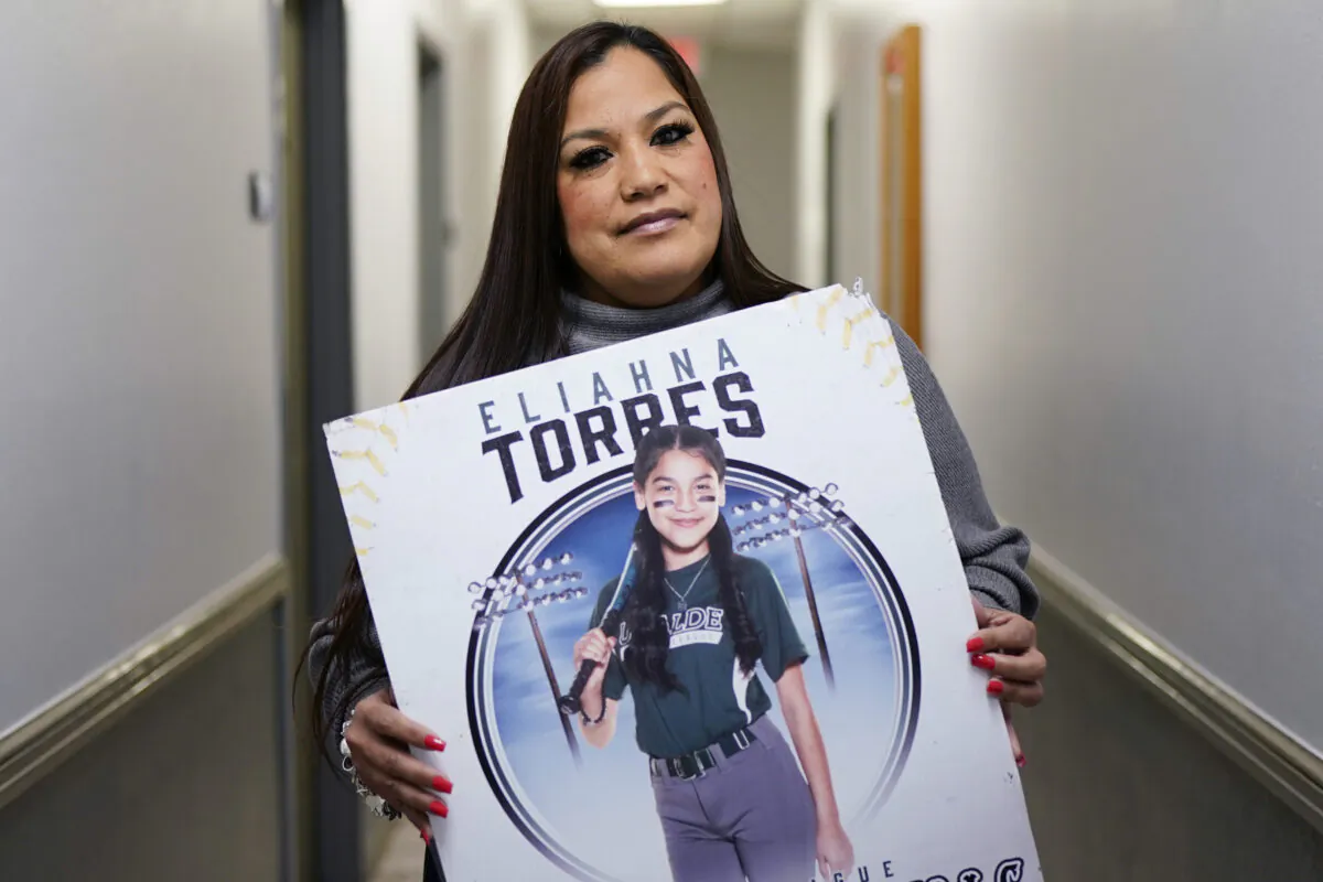Sandra Torres holds a photo of her daughter Eliahna at her attorney's office in San Antonio on Nov. 28, 2022. (Eric Gay/AP Photo)
