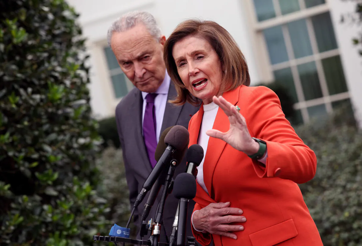 Senate Majority Leader Charles Schumer (D-N.Y.) and Speaker of the House Nancy Pelosi (D-Calif.) speak to reporters outside the White House in Washington on Nov. 29, 2022. (Kevin Dietsch/Getty Images)