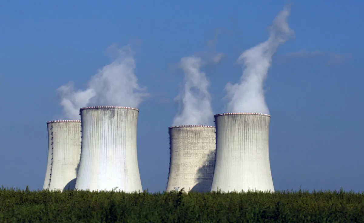 Four of the cooling towers of the Dukovany nuclear power plant rise high above the natural surroundings of Dukovany, Czech Republic, on Sept. 27, 2011. (Petr David Josek/AP Photo)