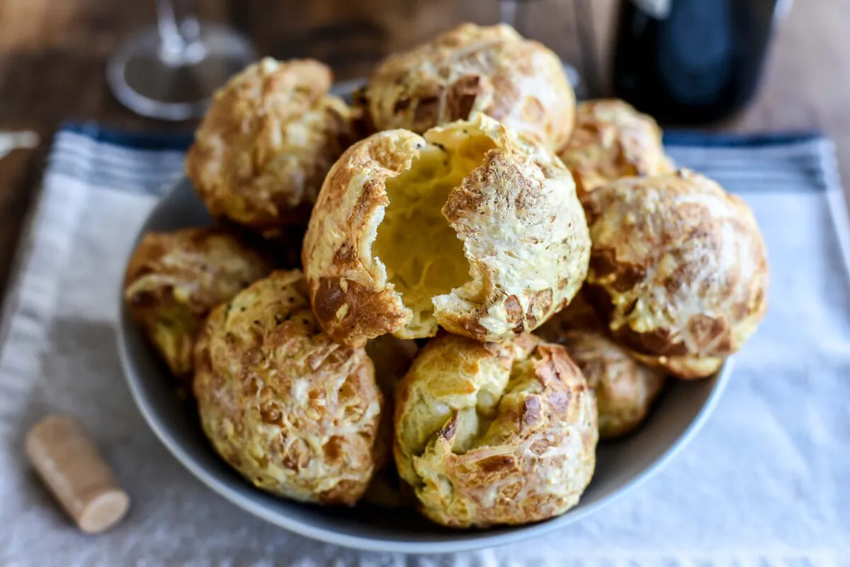 Each gougère features an airy dough and a cheesy crackly exterior, making it a popular holiday addition. (Courtesy of Audrey Le Goff)