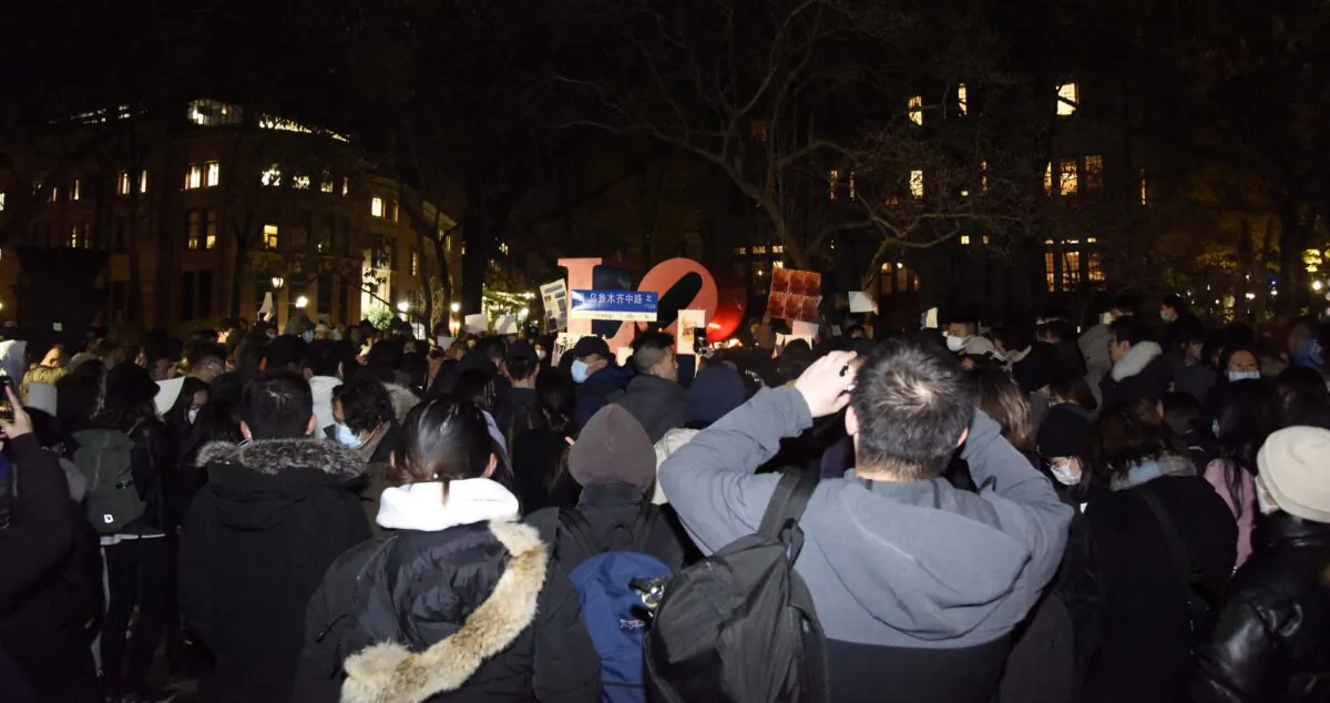 Several hundreds Chinese students at the University of Pennsylvania joined a candlelight vigil to mourn those who lost their lives in the Urumqi fire, in Xinjiang, in support of demonstrations in China calling for an end to COVID-19 lockdowns, on Nov. 29, 2022. (Leon Liu/The Epoch Times)