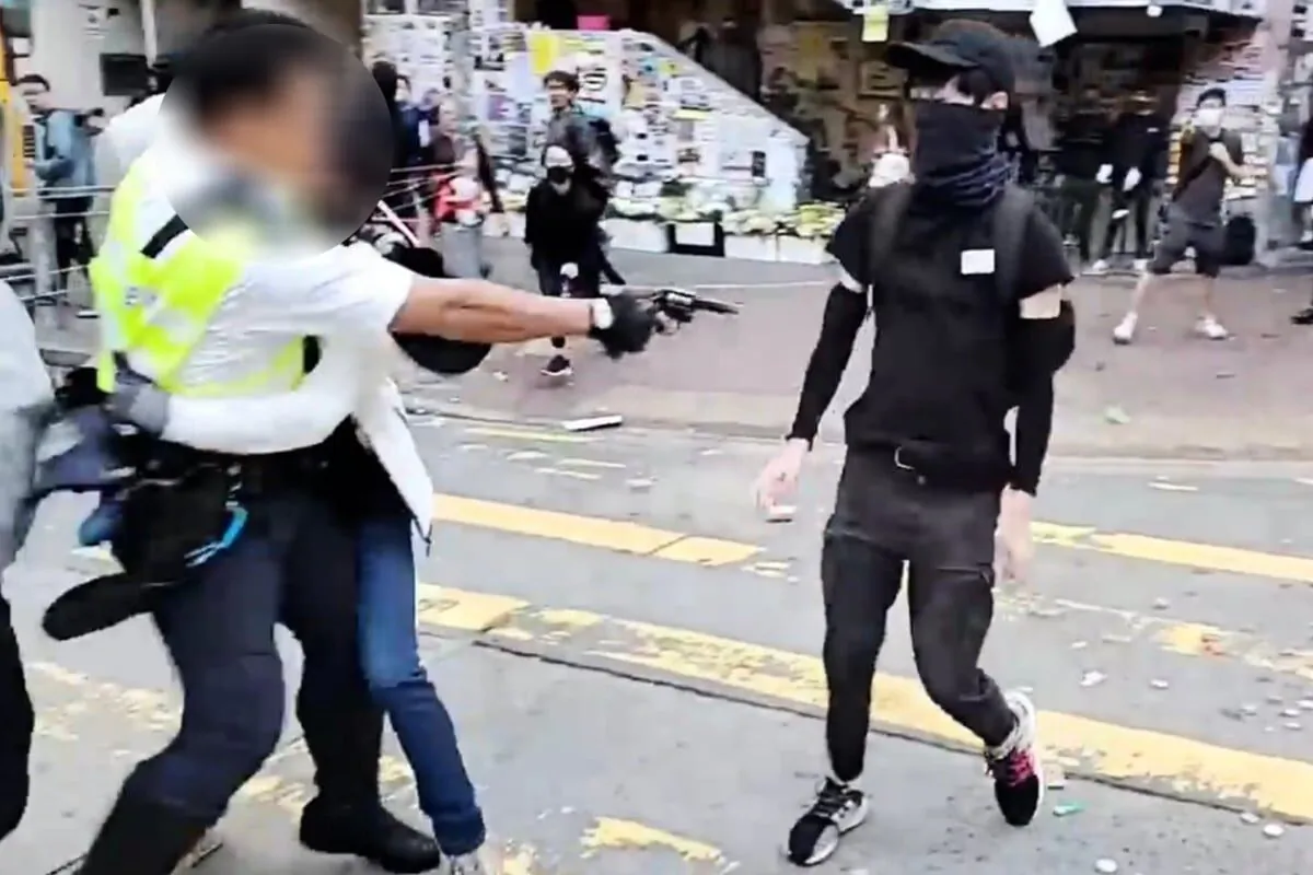 Chow Pak-kwan, unarmed, was shot by a HK police officer on Nov. 11, 2019, during the anti-extradition movement. (YouTube/Screenshot via The Epoch Times)