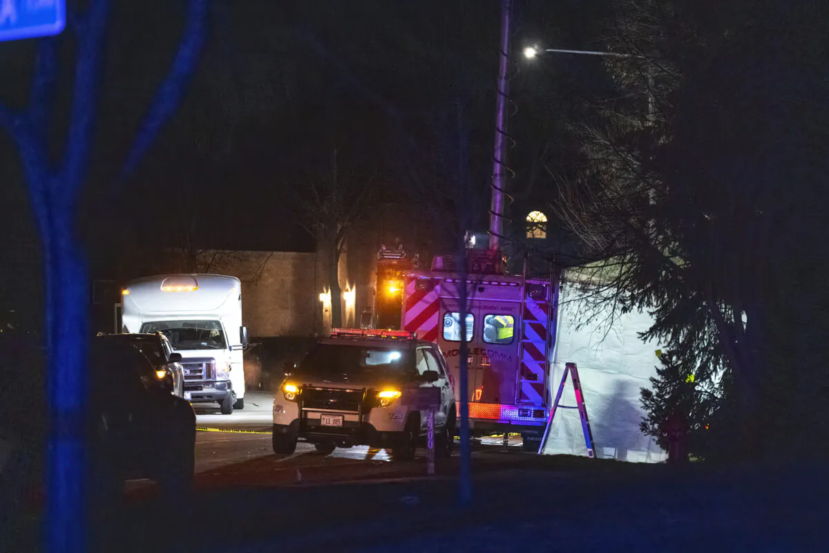 Buffalo Grove emergency responders work the scene where multiple people were found dead inside a home in Buffalo Grove, Ill., on Nov. 30, 2022. (Tyler Pasciak LaRiviere/Chicago Sun-Times via AP)