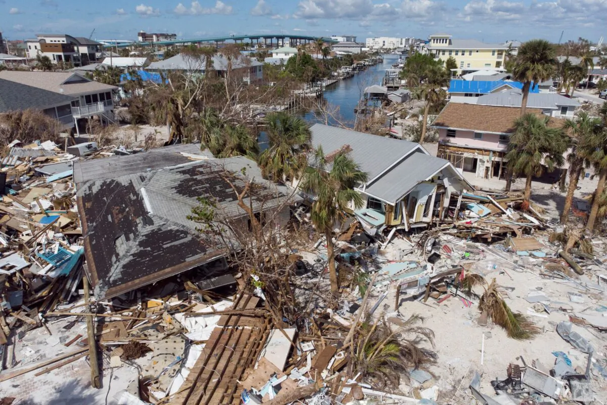 Remains of destroyed houses are seen almost one month after Hurricane Ian landfall, in Fort Myers Beach, Fla., on Oct. 26, 2022. (Marco Bello/Reuters)