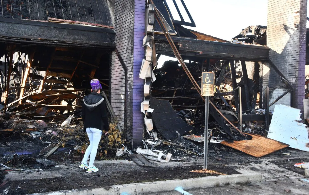 A store manager surveys the damage to Phantom Fireworks in West Melbourne Fla., after it was destroyed by fire on Nov. 28, 2022. (Malcolm Denemark/Florida Today via AP)