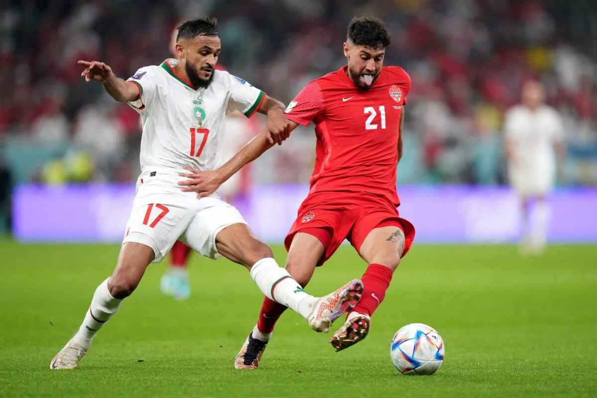 Canada midfielder Jonathan Osorio (21) and Morocco midfielder Sofiane Boufal (17) battle for the ball during second half group F World Cup soccer action at the Al Thumama Stadium in Doha, Qatar on Dec. 1, 2022. (The Canadian Press/Nathan Denette)
