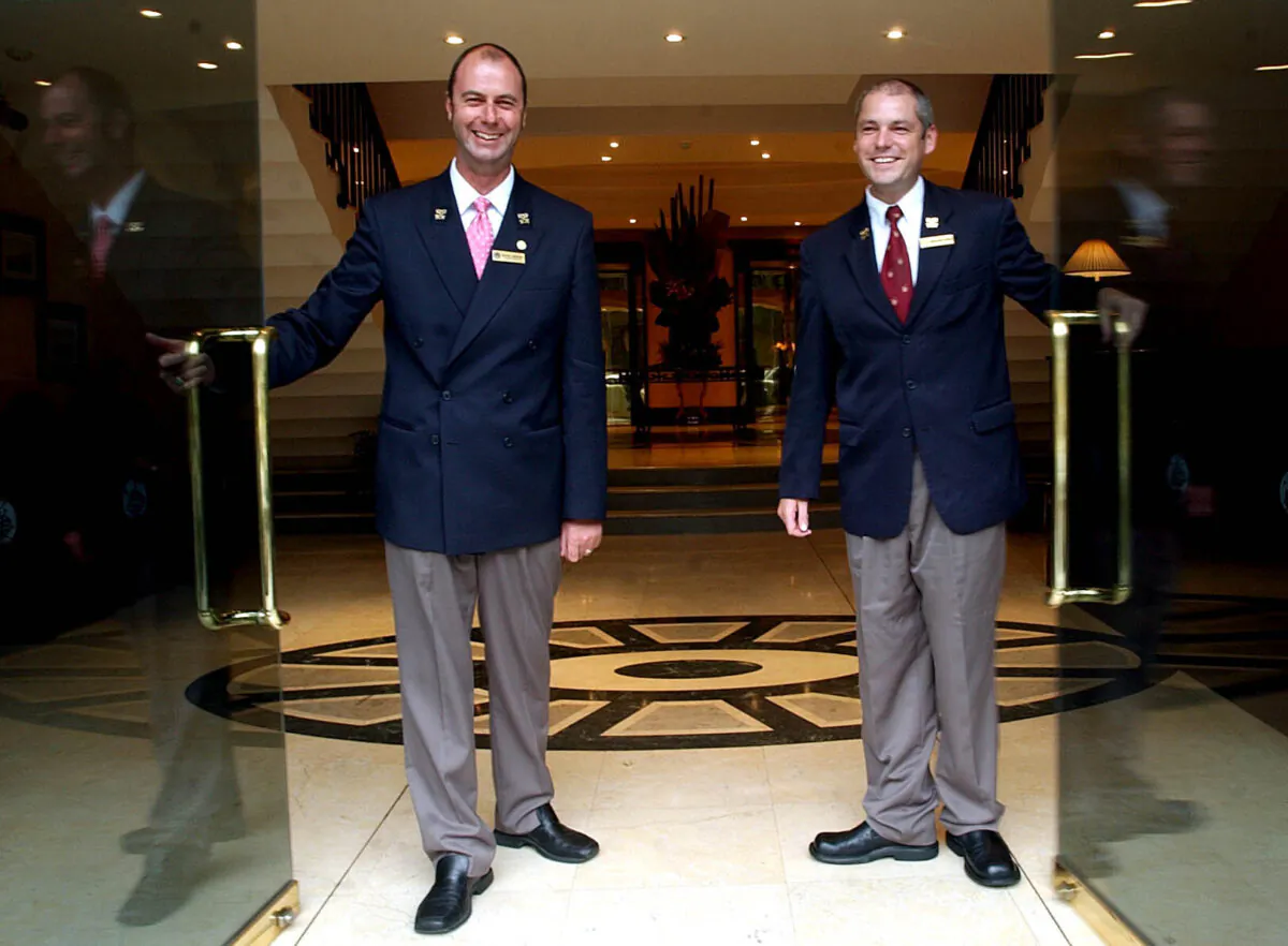 Chief Concierge Michael D. Anderson (L) and Assistant Chief Concierge Simon Matthews from The Observatory Hotel pose for photos in Sydney, Australia, on Feb. 22, 2007. (AAP Image/Jeremy Piper)