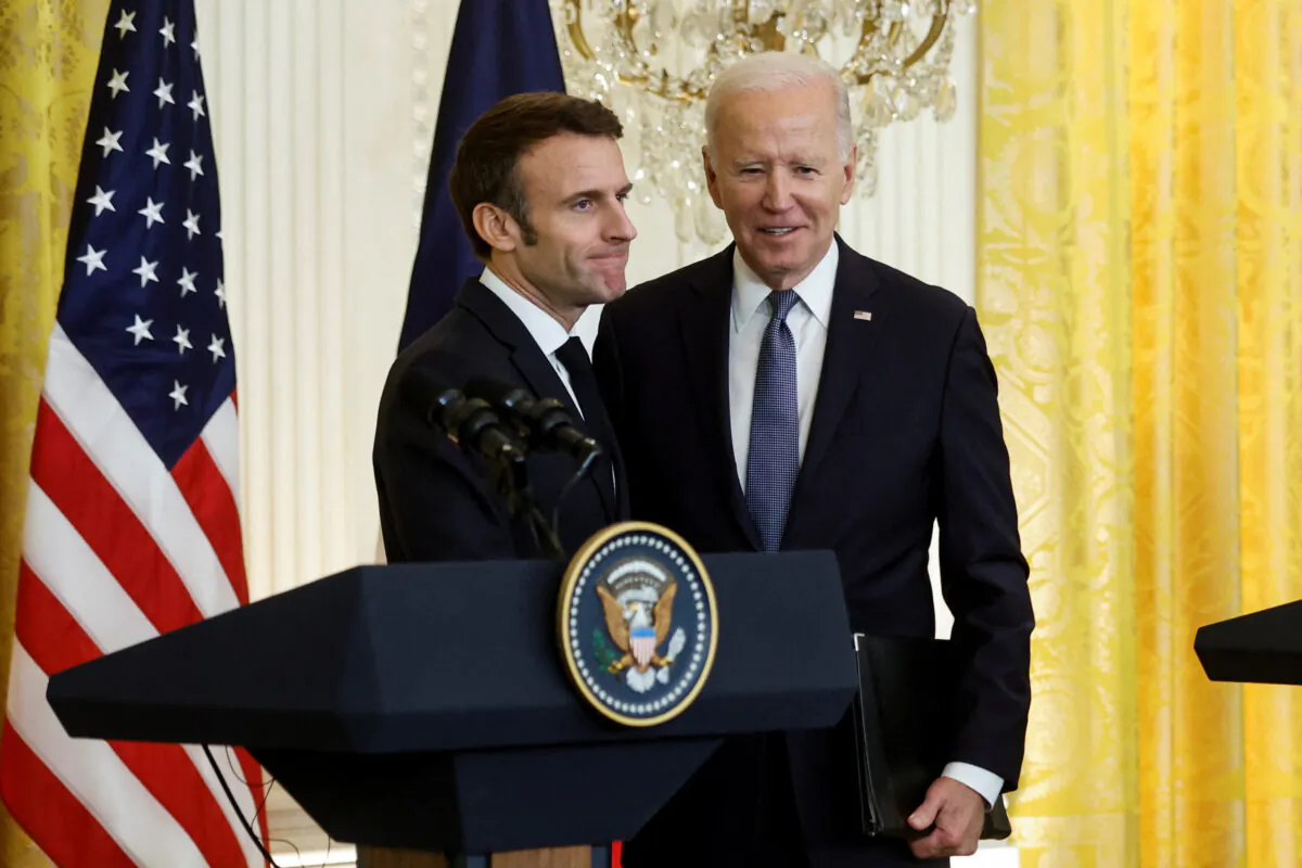French President Emmanuel Macron with U.S. President Joe Biden at the conclusion of their joint news conference in the East Room of the White House in Washington on Dec. 1, 2022. (Jonathan Ernst/Reuters)