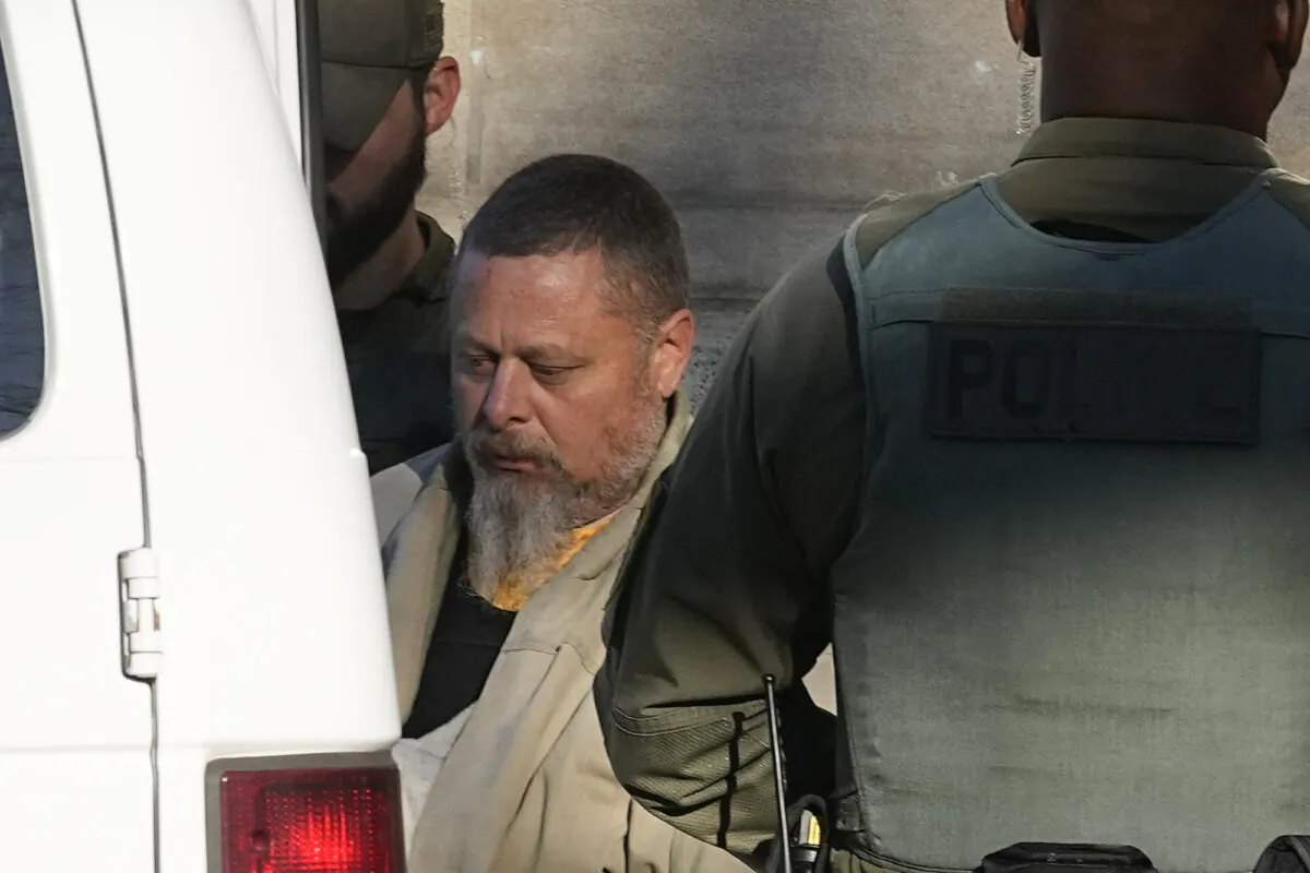 Officers escort Richard Matthew Allen out of the Carroll County courthouse following a hearing in Delphi, Ind., on Nov. 22, 2022. (Darron Cummings/AP Photo)