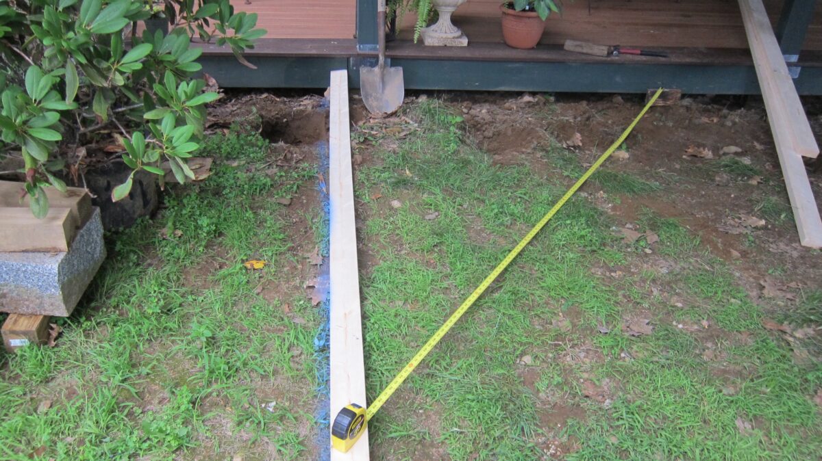 You can often square things up by yourself. In this case, I was able to get the flat 2x6 square with the front edge of the deck using a marker and a tape measure. It’s so easy to do! (Tim Carter/Tribune Content Agency)