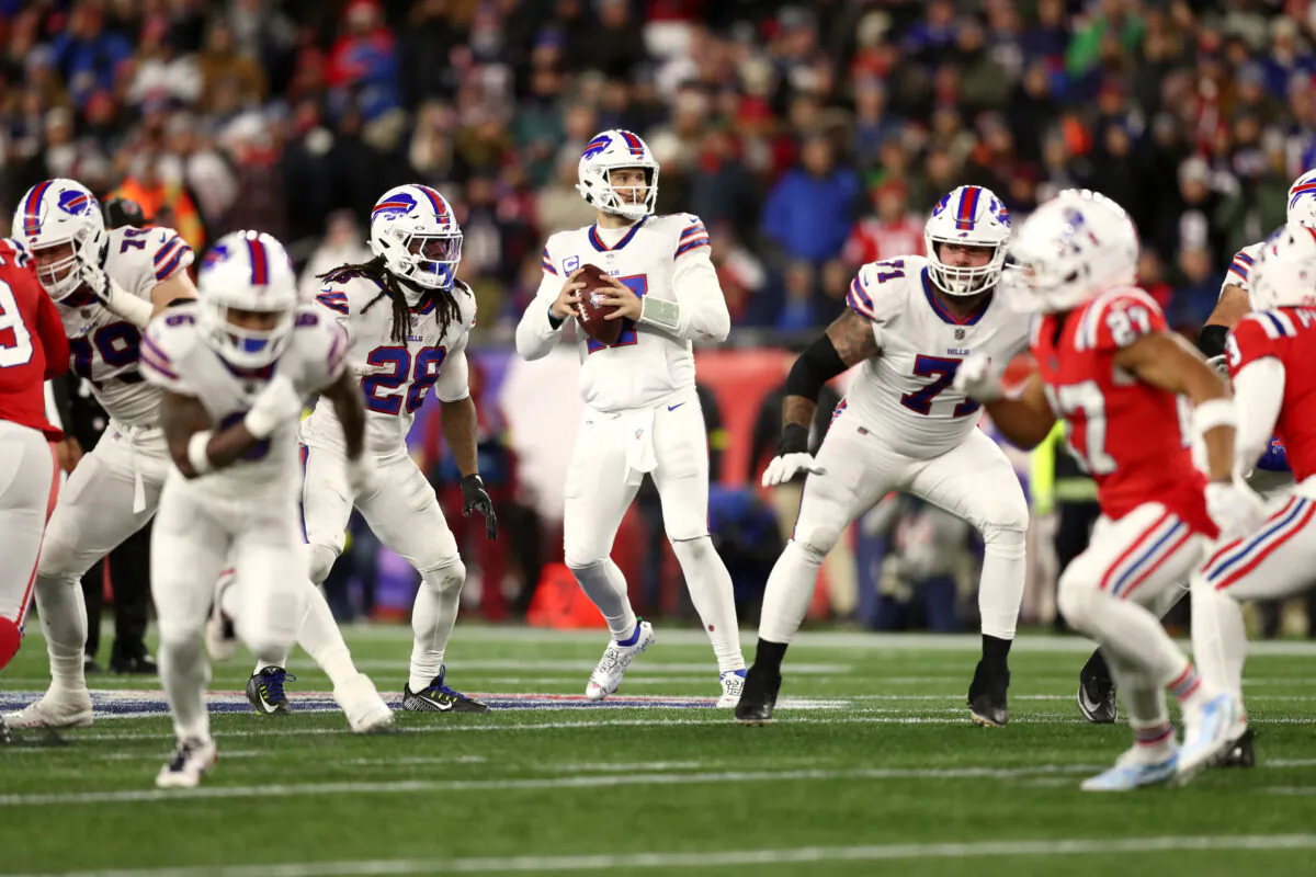 Quarterback Josh Allen (17) of the Buffalo Bills drops back to pass against the New England Patriots in the second half at Gillette Stadium in Foxborough, Mass., on Dec. 1, 2022. (Adam Glanzman/Getty Images)