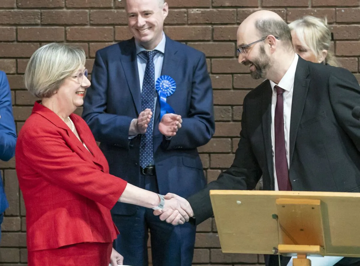 Labour candidate Samantha Dixon is congratulated after winning the Chester by-election following the count at Northgate Arena Leisure Centre in Chester, England in the early hours of Dec. 2, 2022. (PA)