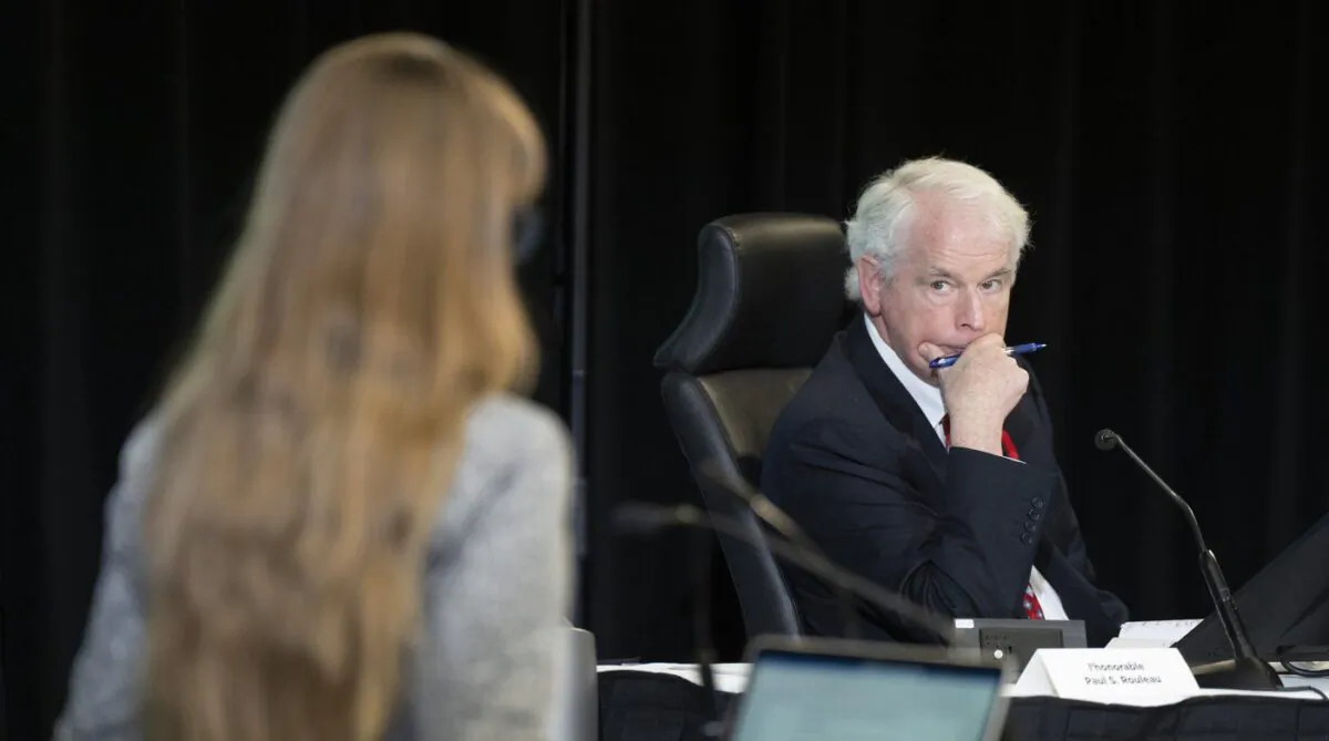 Commissioner Paul Rouleau listens to counsel question a witness at the Public Order Emergency Commission, in Ottawa, Nov. 4, 2022. (The Canadian Press/Adrian Wyld)