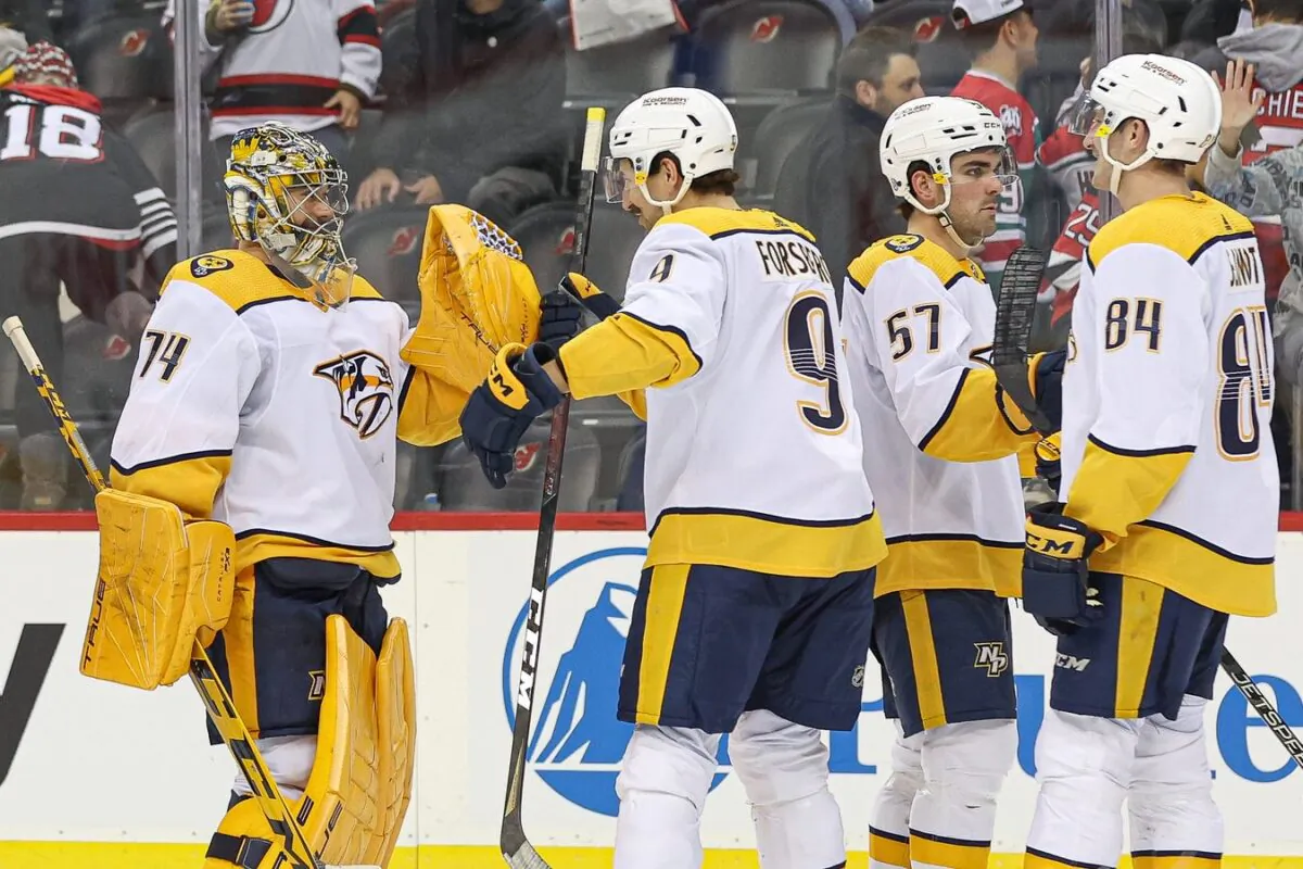 Nashville Predators goaltender Juuse Saros (74) celebrates with left wing Filip Forsberg (9) after defeating the New Jersey Devils in overtime at Prudential Center in Newark, N.J., on Dec. 1, 2022. (Vincent Carchietta/USA TODAY Sports, via Field Level Media)