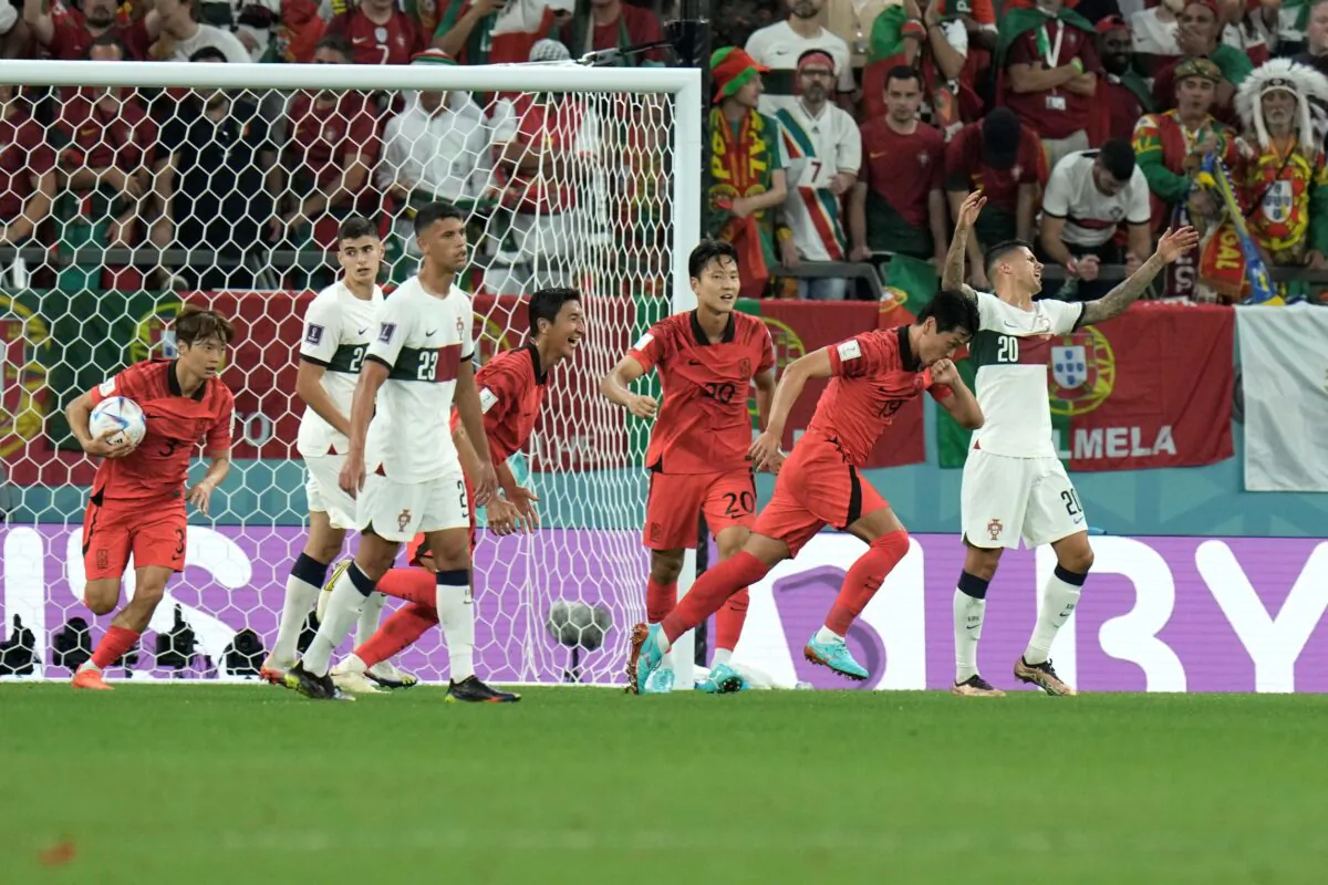 South Korea's Kim Young-gwon, (2nd-R) celebrates after scoring his side's first goal during the World Cup group H soccer match between South Korea and Portugal, at the Education City Stadium in Al Rayyan, Qatar, on Dec. 2, 2022. (Hassan Ammar/AP Photo)