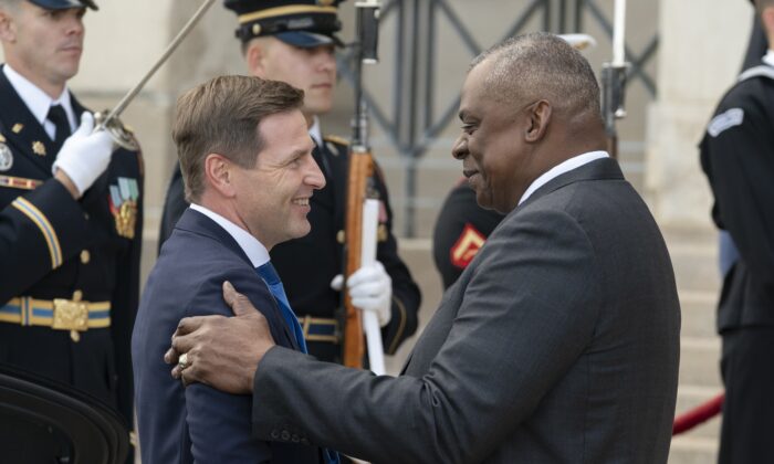 Estonia's Defense Minister Hanno Pevkul (left) is greeted by Defense Secretary Lloyd Austin at an honorary cordon ceremony as he arrives at the Pentagon in Washington on Oct. 18, 2022.  (Alex Brandon/AP Photo)