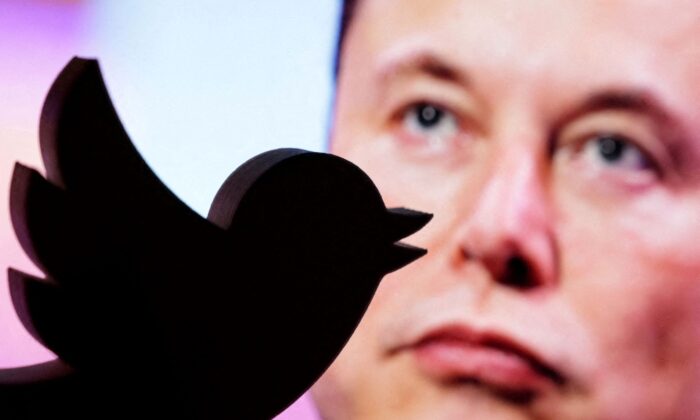 A 3D-printed Twitter logo is seen in front of a displayed photo of Elon Musk in this illustration taken on Oct. 27, 2022. (Dado Ruvic/Illustration/Reuters)