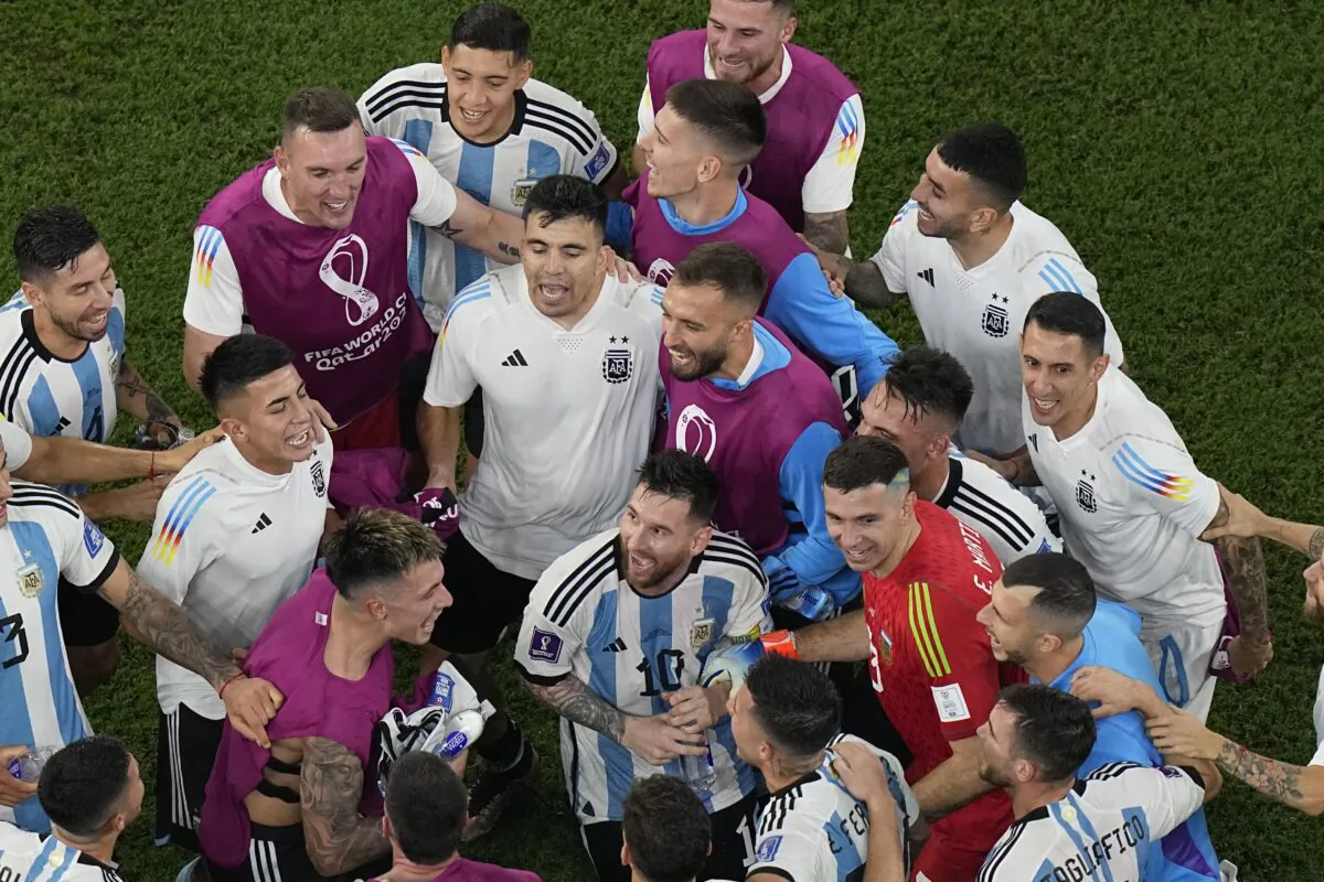 Argentina's Lionel Messi (C) and teammates celebrate after their team's 2–1 victory over Australia during the World Cup round of 16 soccer match between Argentina and Australia at the Ahmad Bin Ali Stadium in Doha, Qatar, on Dec. 3, 2022. (Pavel Golovkin/AP Photo)