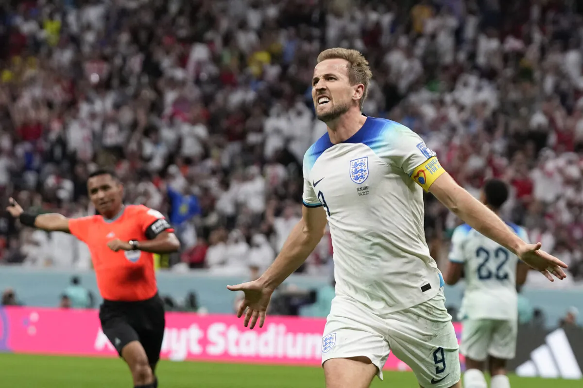 England's Harry Kane celebrates scoring his side's second goal during the World Cup round of 16 soccer match between England and Senegal, at the Al Bayt Stadium in Al Khor, Qatar, on Dec. 4, 2022. (Frank Augstein/AP Photo)