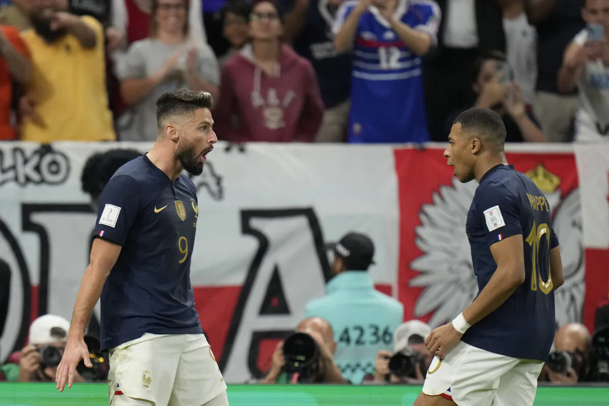 France's Olivier Giroud celebrates after scoring his side's first goal with France's Kylian Mbappe (R) during the World Cup round of 16 soccer match between France and Poland, at the Al Thumama Stadium in Doha, Qatar, on Dec. 4, 2022. (Moises Castillo/AP Photo)