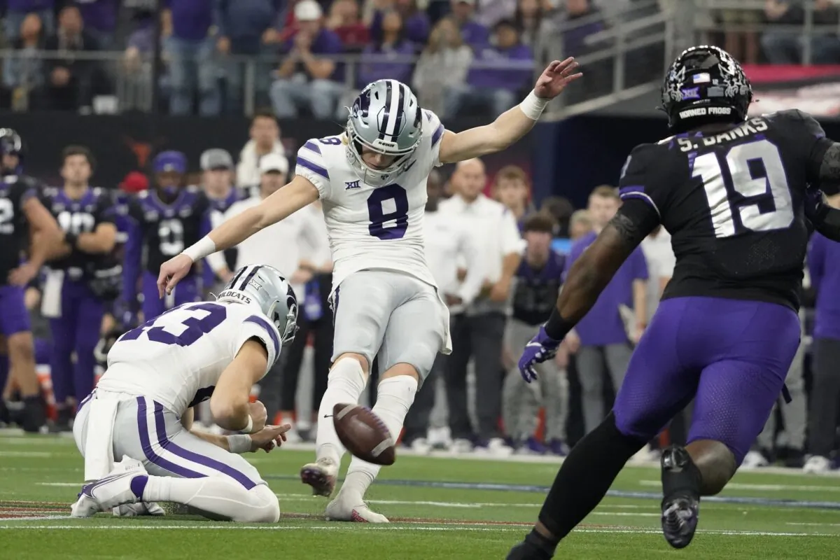 Kansas State's Ty Zentner kicks a field goal past TCU linebacker Shadrach Banks (19) in overtime of the Big 12 Conference championship NCAA college football game in Arlington, Texas, on Dec. 3, 2022. (LM Otero/AP Photo)