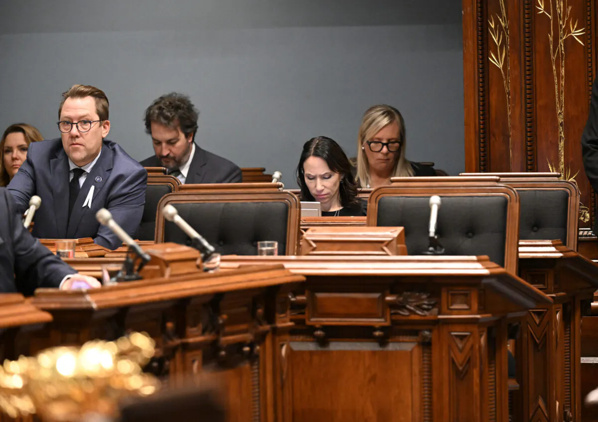 The three empty seats that would be occupied by the three Parti Quebecois elected MNAs during question period at the legislature in Quebec City on Dec. 1, 2022. The MNAs were refused entrance to the Salon Bleu because they refused to swear an oath of allegiance to the King. (The Canadian Press/Jacques Boissinot)