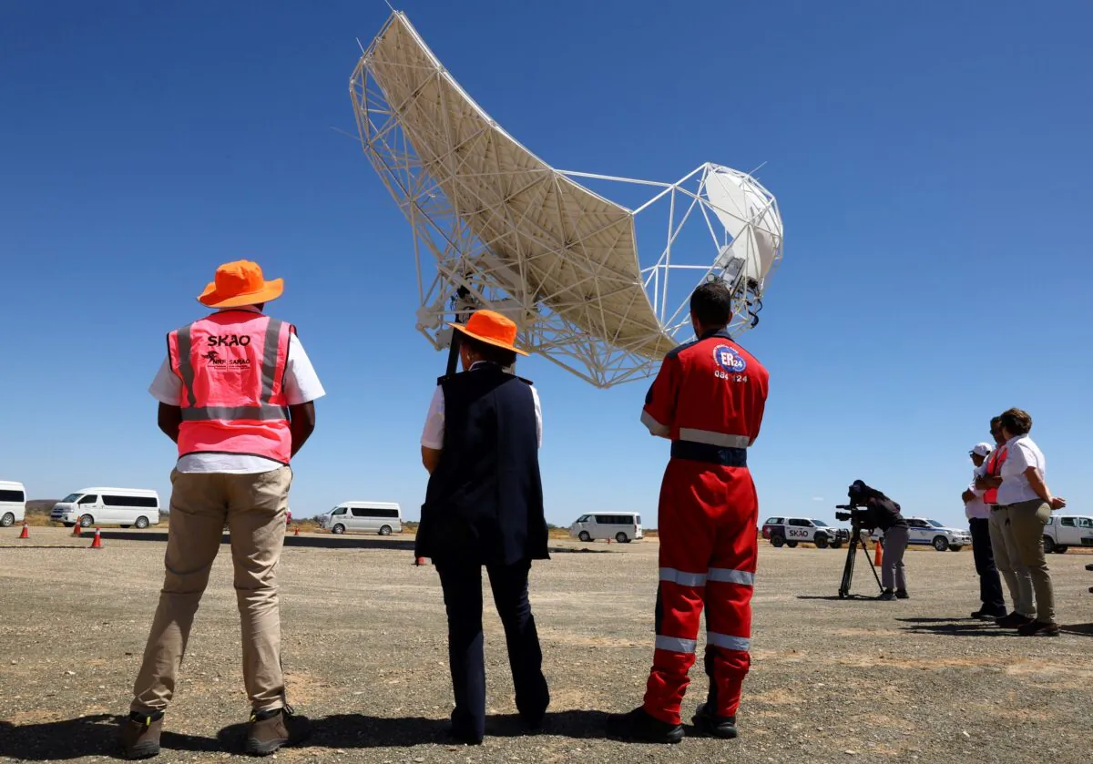 People look at South Africa's prototype dish of the Square Kilometre Array-Mid telescope outside the town of Carnarvon, with a similar ceremony taking place in SKA co-host Australia on the same day, South Africa on Dec. 5, 2022. (Esa Alexander/Reuters)
