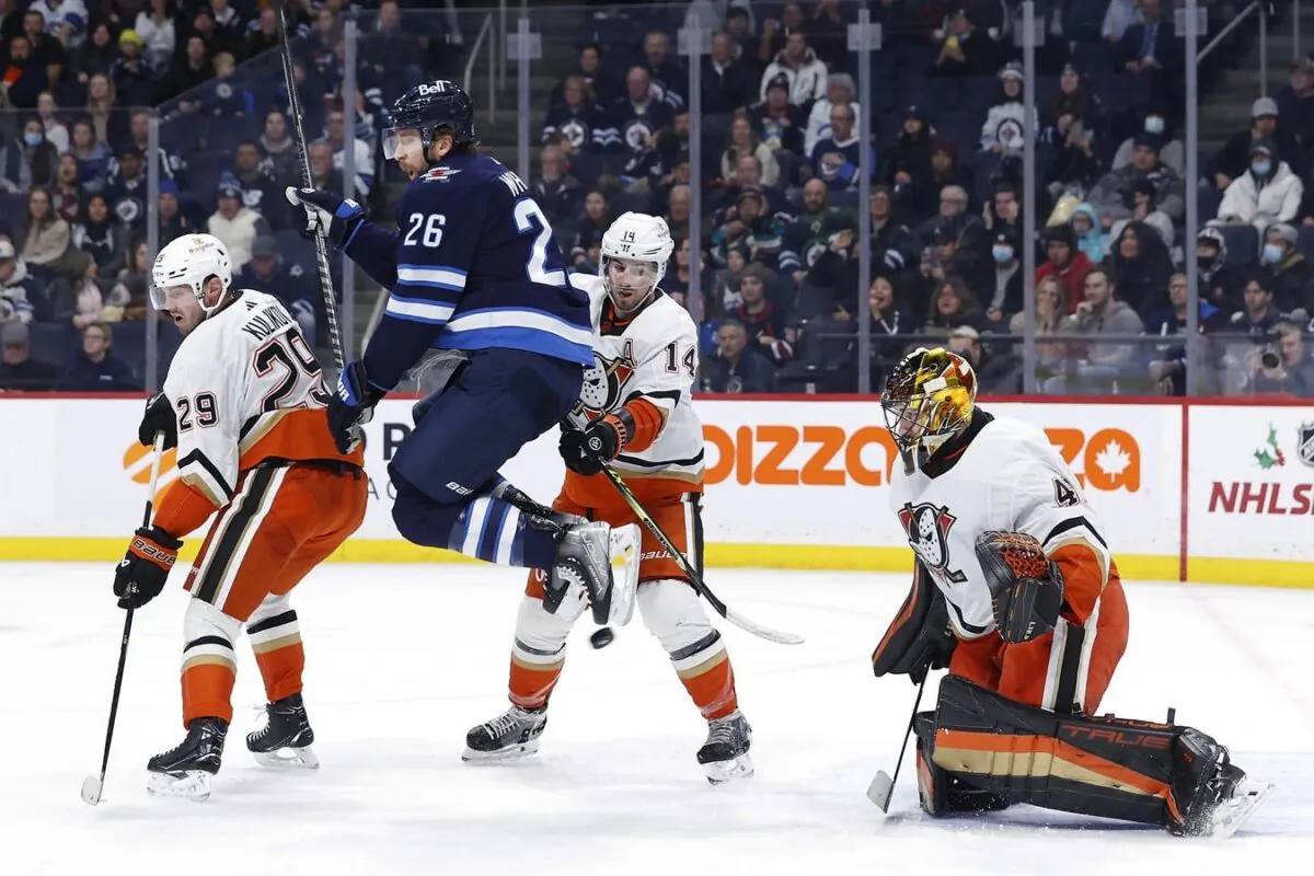 Winnipeg Jets right wing Blake Wheeler (26) leaps from the puck in front of Anaheim Ducks goaltender Anthony Stolarz (41) in the second period at Canada Life Centre, Winnipeg, Manitoba, Canada, on Dec. 4, 2022. (James Carey Lauder/USA TODAY Sports via Field Level Media)
