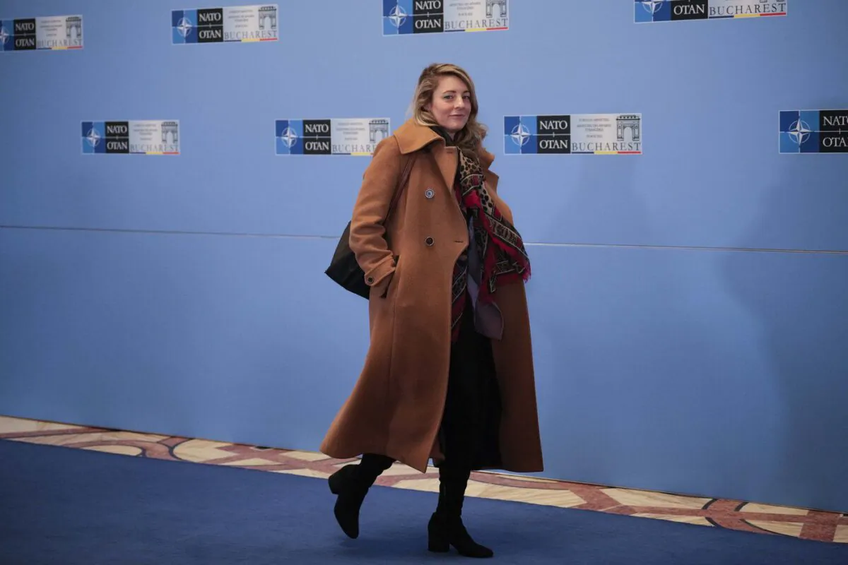 Canada's Foreign Minister Melanie Joly walks past journalists on second day of the meeting of NATO Ministers of Foreign Affairs, in Bucharest, Romania, Nov. 30, 2022 (The Canadian Press/AP-Vadim Ghirda)
