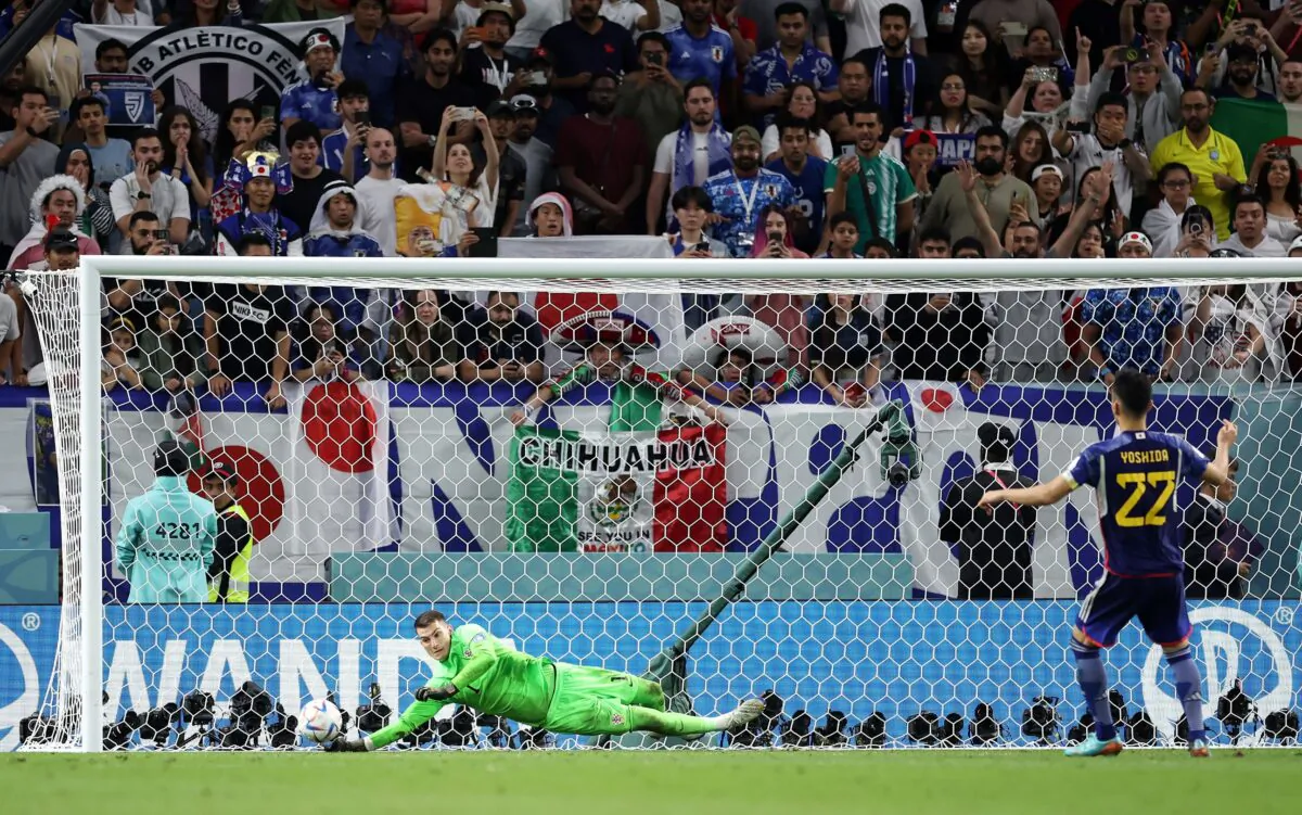 Dominik Livakovic of Croatia saves the fourth penalty by Maya Yoshida of Japan in the penalty shoot out during the FIFA World Cup Qatar 2022 Round of 16 match between Japan and Croatia at Al Janoub Stadium in Al Wakrah, Qatar, on Dec. 5, 2022. (Alex Grimm/Getty Images)