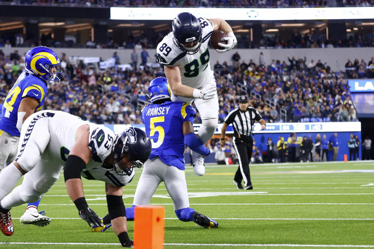 Will Dissly (89) of the Seattle Seahawks is tackled by Jalen Ramsey (5) of the Los Angeles Rams during the fourth quarter of the game at SoFi Stadium in Inglewood, Calif.,  on Dec. 4, 2022. (Ronald Martinez/Getty Images)
