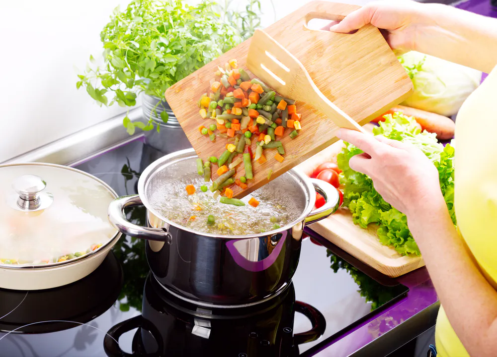 Even beginner cooks can simmer together a pot of warm, nourishing soup with ease. (Nitr/Shutterstock)