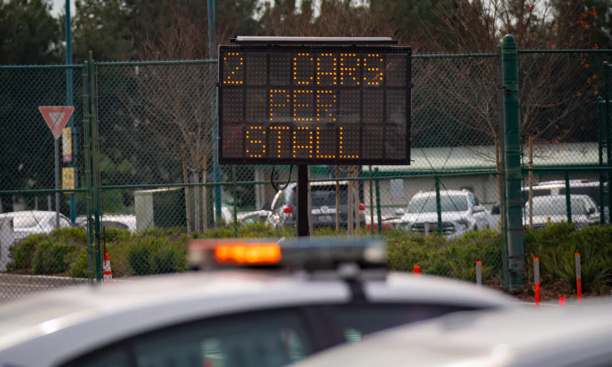 A police vehicle monitors one of Disneyland's parking areas in Anaheim, Calif., on Jan. 13, 2022. (John Fredricks/The Epoch Times)