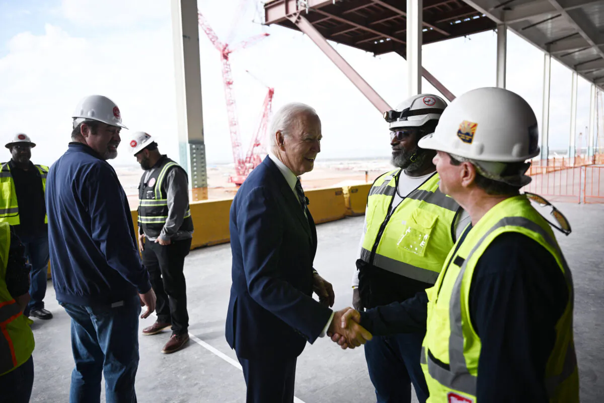 President Joe Biden (C) greets workers as he tours the TSMC Semiconductor Manufacturing Facility in Phoenix on Dec. 6, 2022. (Brendan Smialowski/AFP via Getty Images)