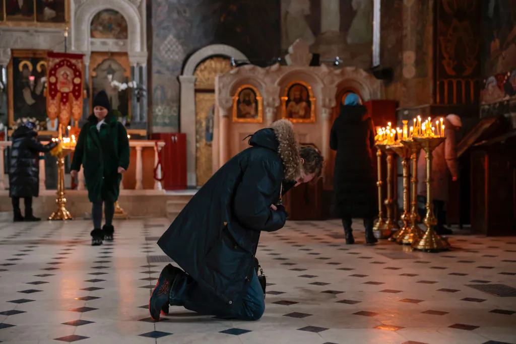 Members of the public pray at Kiev Pechersk Lavra  in Kyiv, Ukraine, on Dec. 4, 2022. (Jeff J. Mitchell/Getty Images)