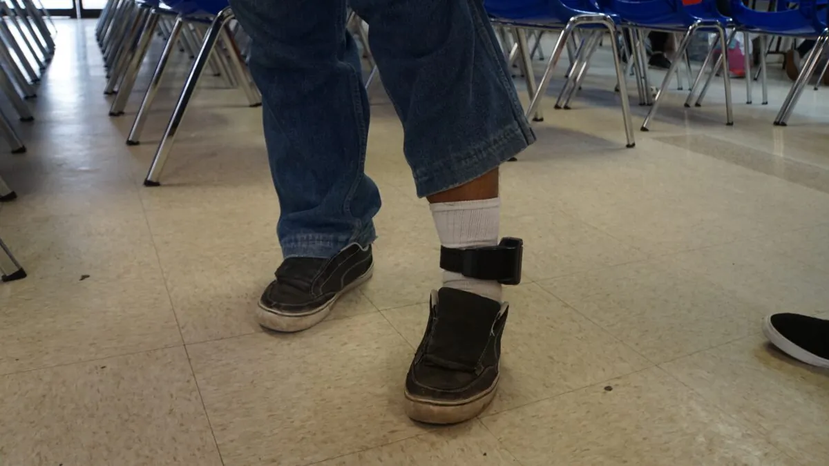 A tracker is seen on the ankle of Edilberto Garcia in a humanitarian center in the border town of McAllen, Texas, on June 14, 2018. (Leila Macor/AFP via Getty Images)