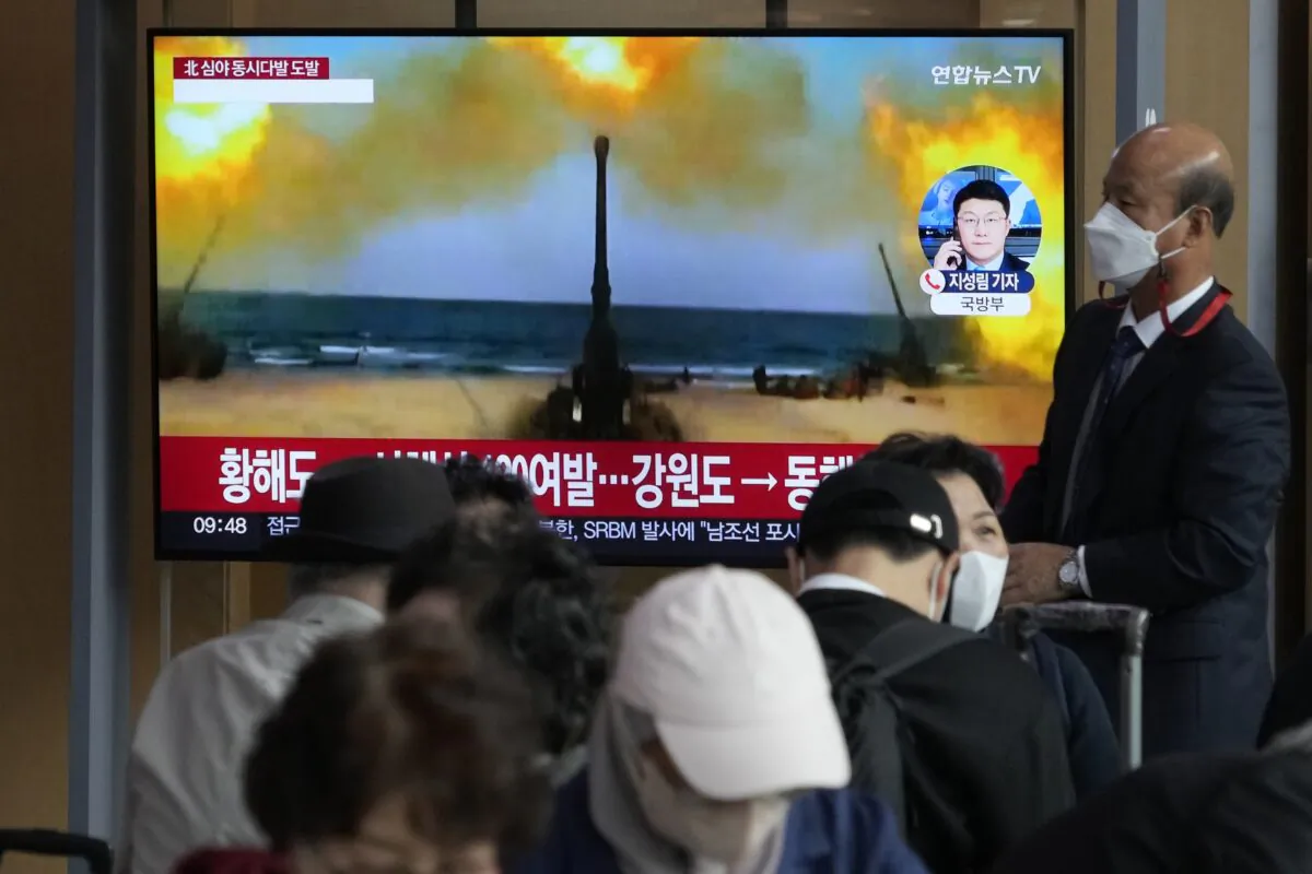 A TV screen shows a file image of North Korea's military exercise during a news program at the Seoul Railway Station in Seoul, South Korea, on Oct. 14, 2022. (Ahn Young-joon/AP Photo)