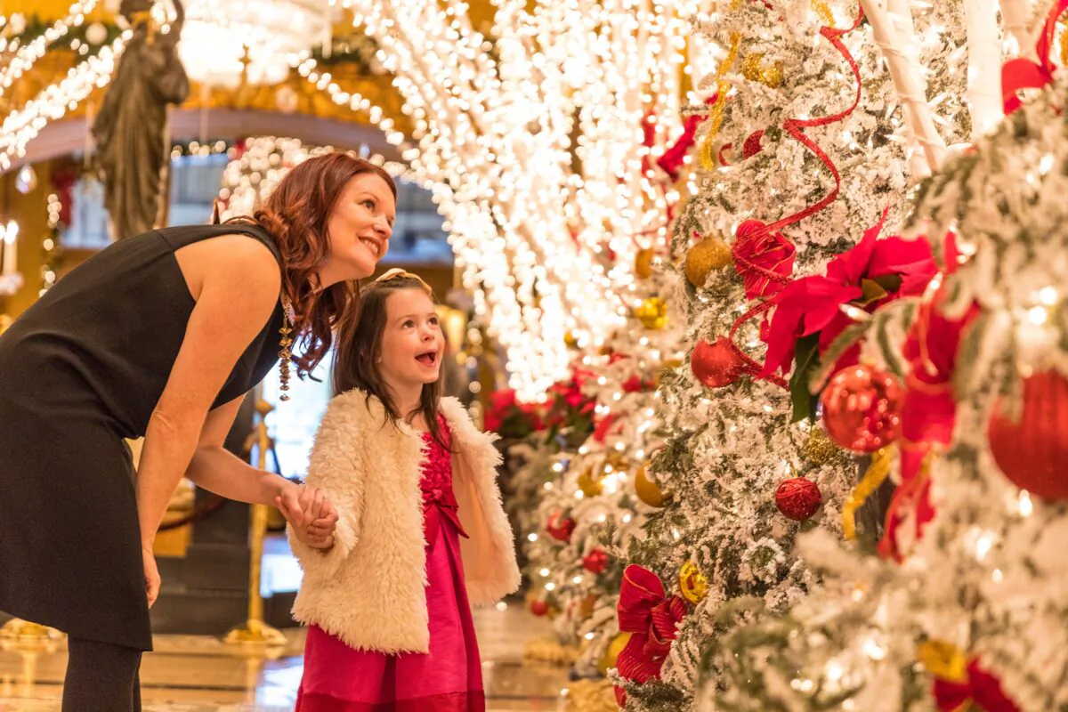A mother and daughter enjoy a Christmas lighting display in New Orleans. (Zack Smith/New Orleans & Company/TNS)