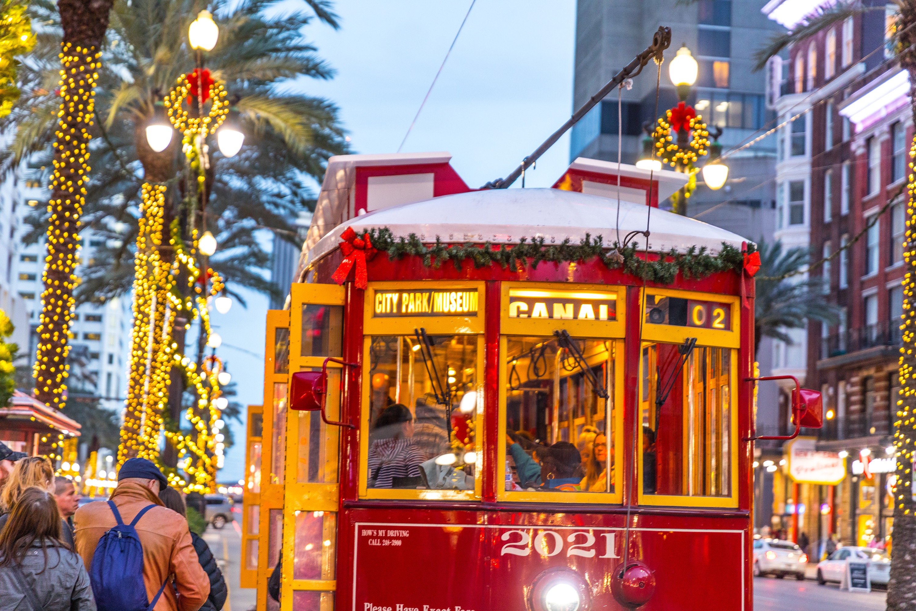 New Orleans trolley with bows and garlands.