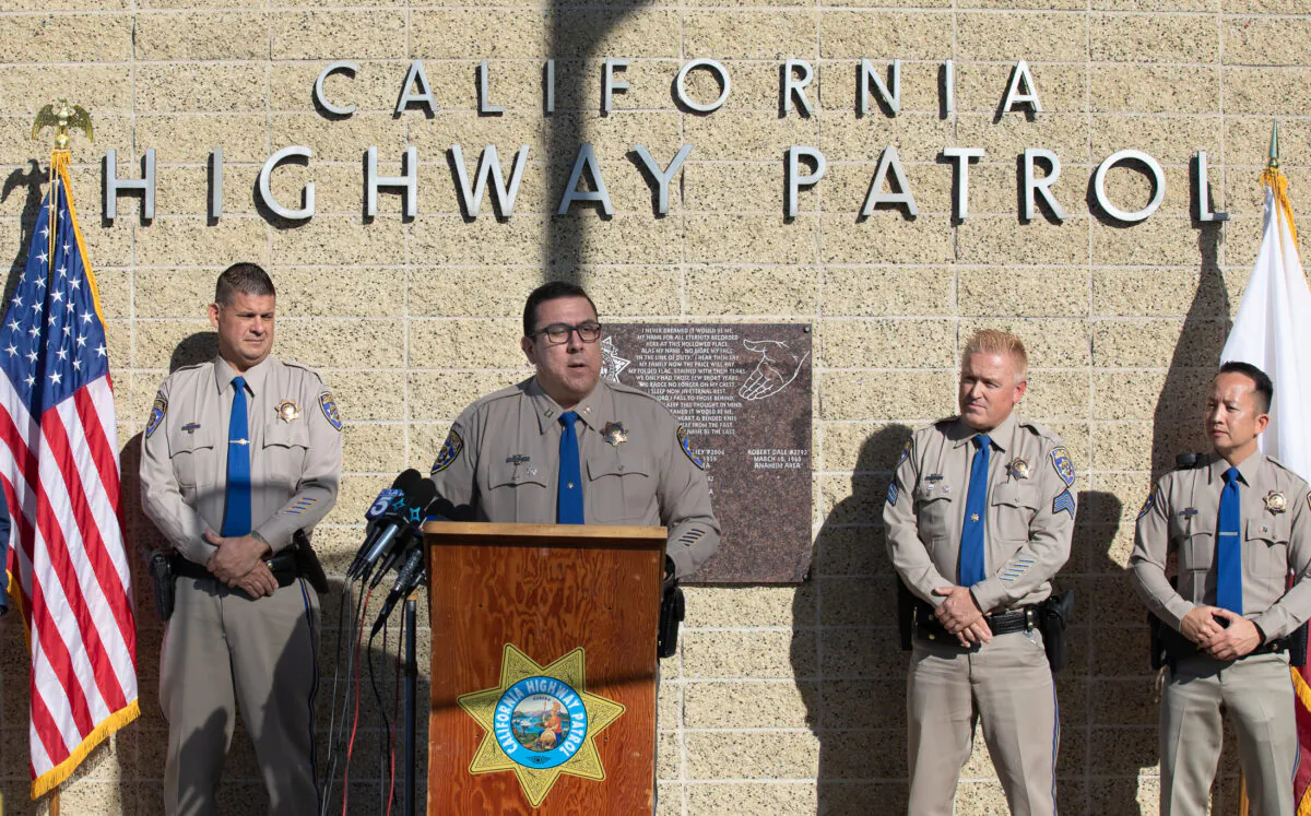California Highway Patrol Capt. Gil Campo, at podium, speaks about 27 arrests as part of the ongoing Operation Sign-Off in Santa Ana, Calif., on Dec. 7, 2022. (John Fredricks/The Epoch Times)