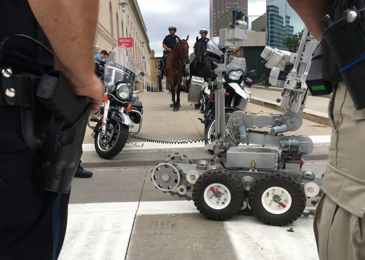 Police officers demonstrate some of their security assets, including remote-controlled robots, horse-mounted officers, and bomb-sniffing dogs, in Cleveland, Ohio, on July 14 2016. (Michael Mathes/AFP via Getty Images)