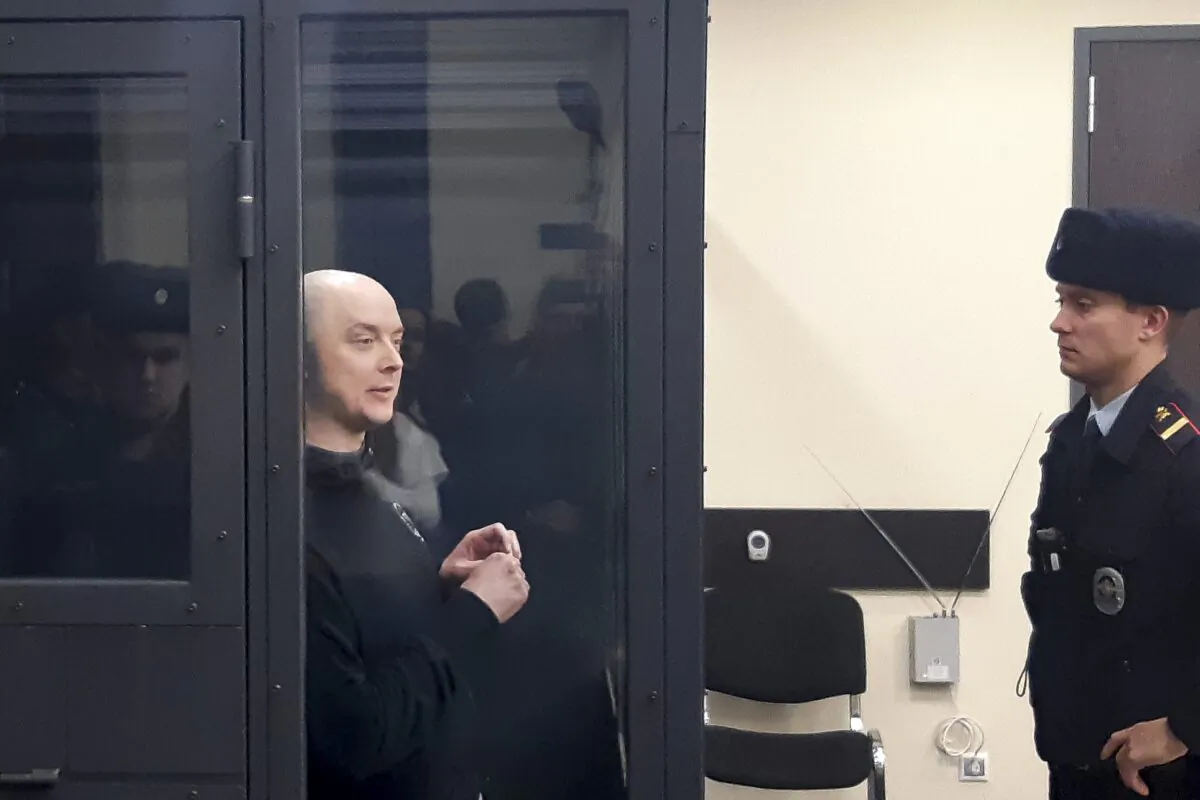 Ivan Safronov, an adviser to the director of Russia's state space corporation is seen on a TV screen, as he appears in a video link provided by the Russian Federal Penitentiary Service in a courtroom of the First Cassation Court of General Jurisdiction in Moscow on Dec. 7, 2022. (Sergei Fedotov/AP Photo)