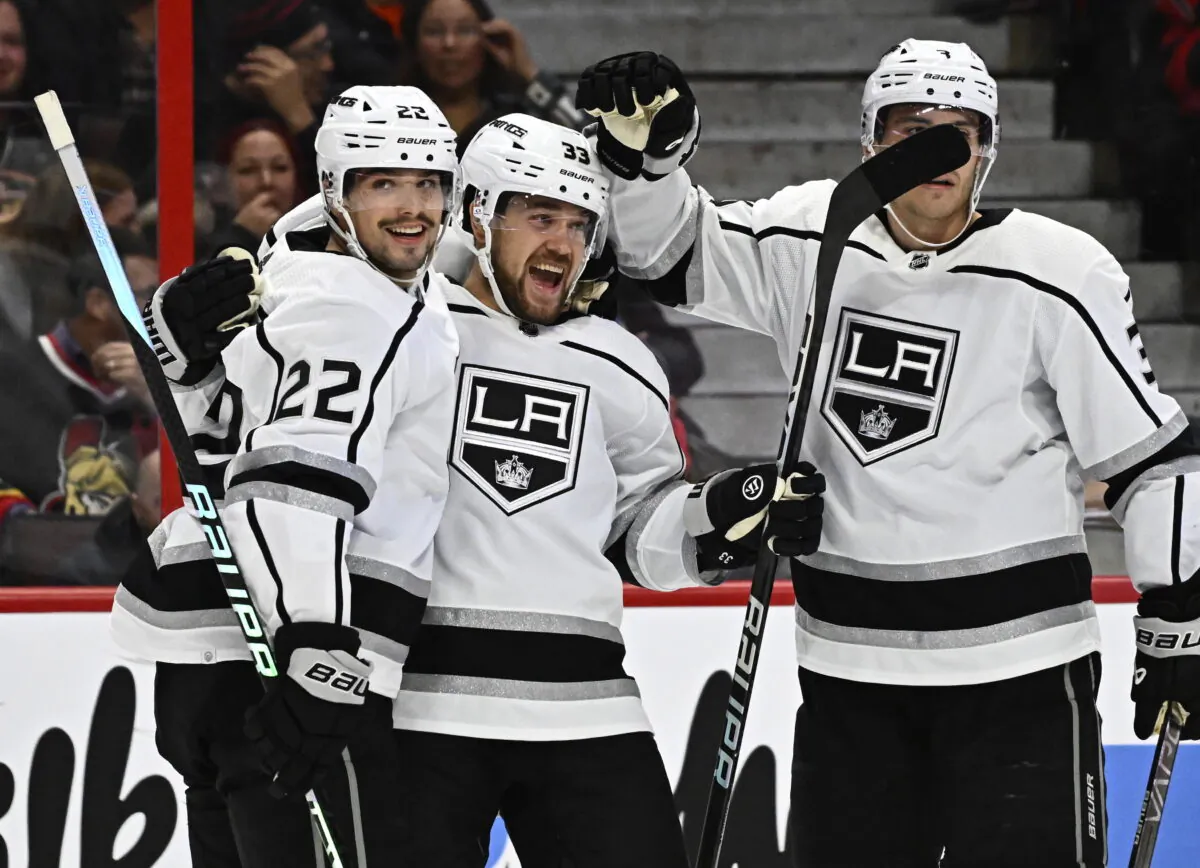 Los Angeles Kings right wing Viktor Arvidsson celebrates scoring his second goal of the game against the Ottawa Senators with teammates Kevin Fiala (22) and Matt Roy during the first period of an NHL hockey game, in Ottawa, Ontario, Dec. 6, 2022. (Justin Tang/The Canadian Press via AP)